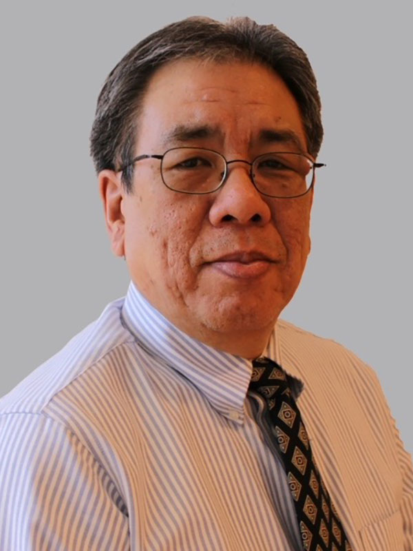 A headshot of Dr. Steven B. Chin, who wears a stripped dress shirt and tie.